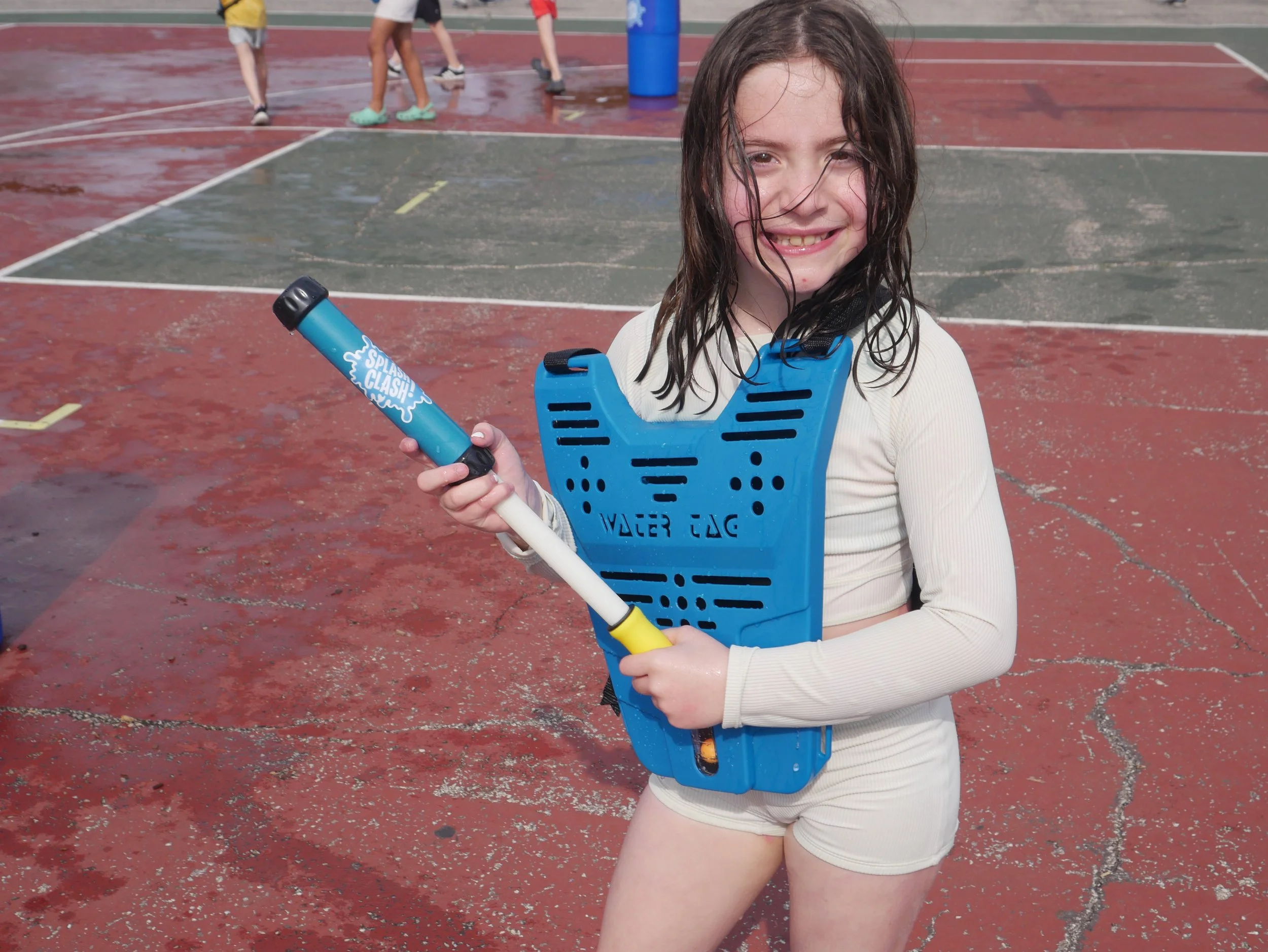 Splash Clash player with vest and water blaster