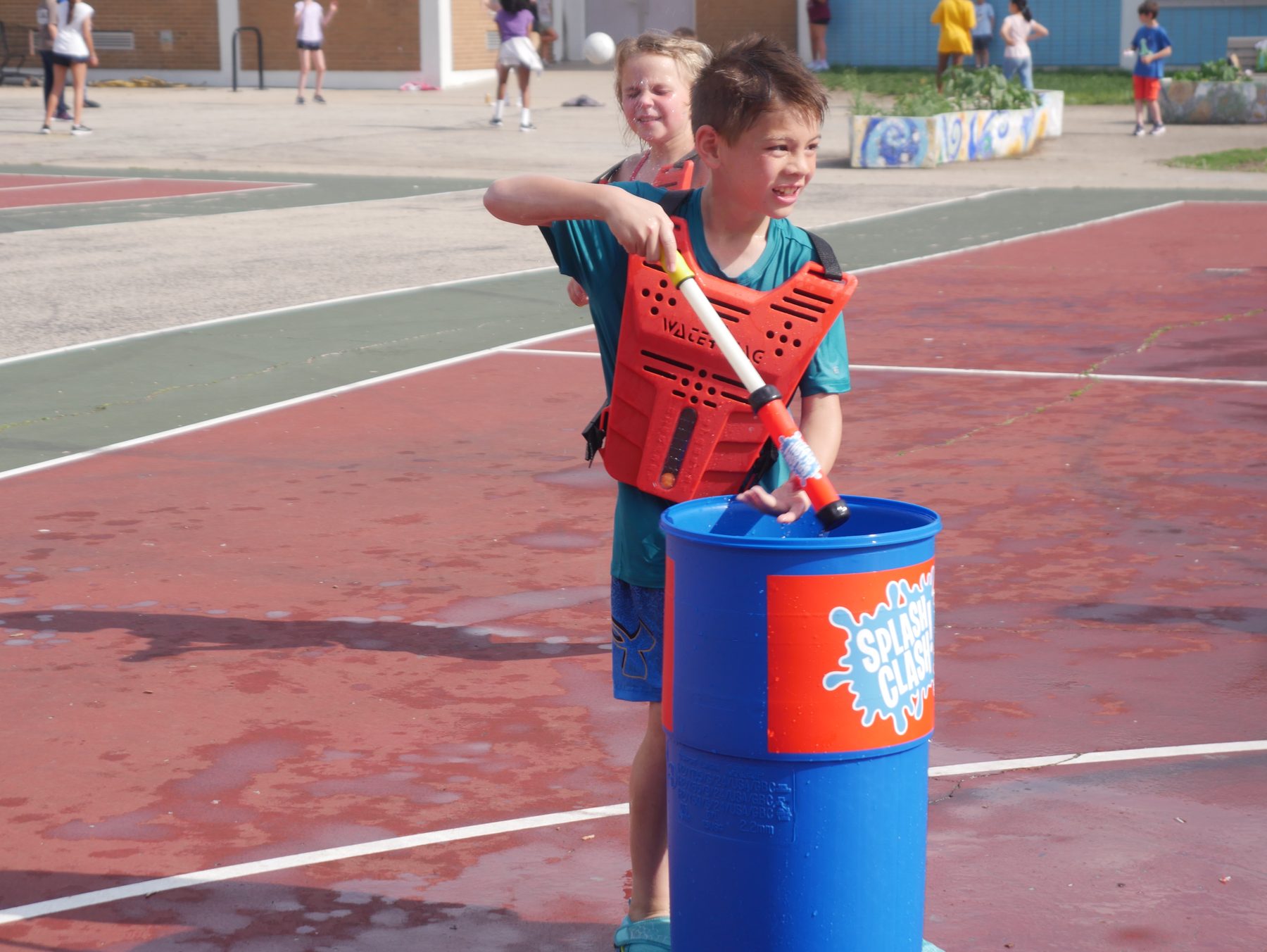 Player refilling a water blaster at a Splash Clash reservoir